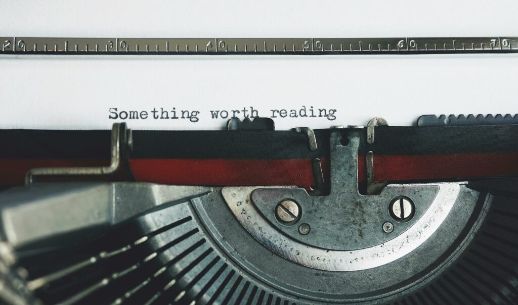 Typewriting with script ‘something worth reading’ symbolizing great listing descriptions in property marketing