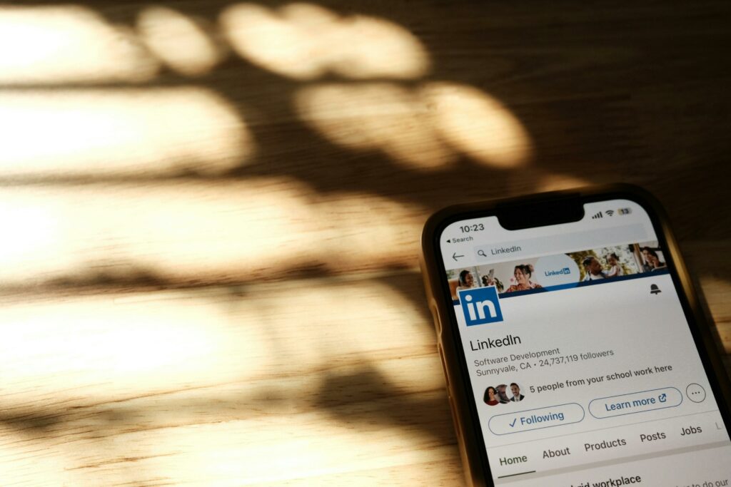 Smartphone with LinkedIn pulled up, where you can do some great social media ads for realtors