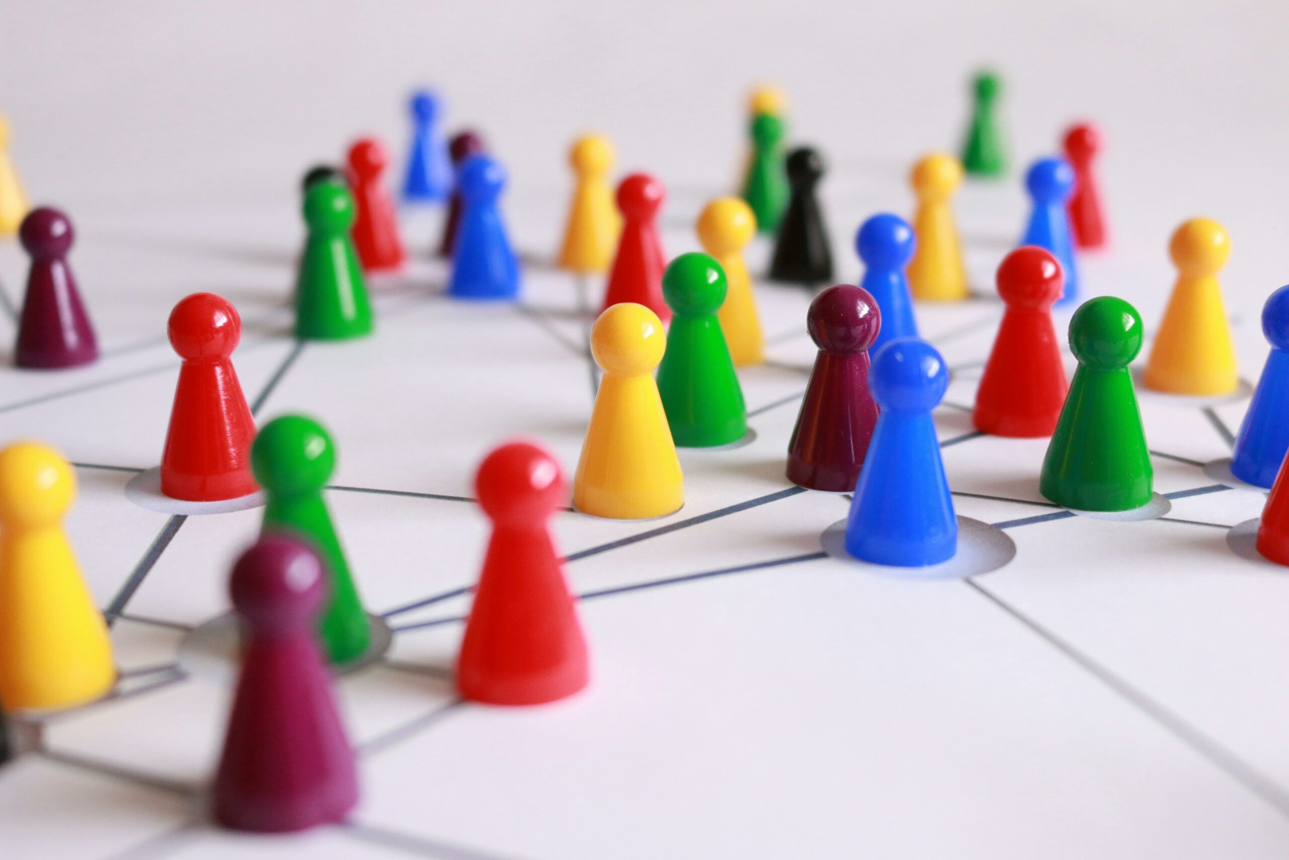 photo of colorful game pieces arranged like a network to represent marketing and making connections with lead generation for real estate