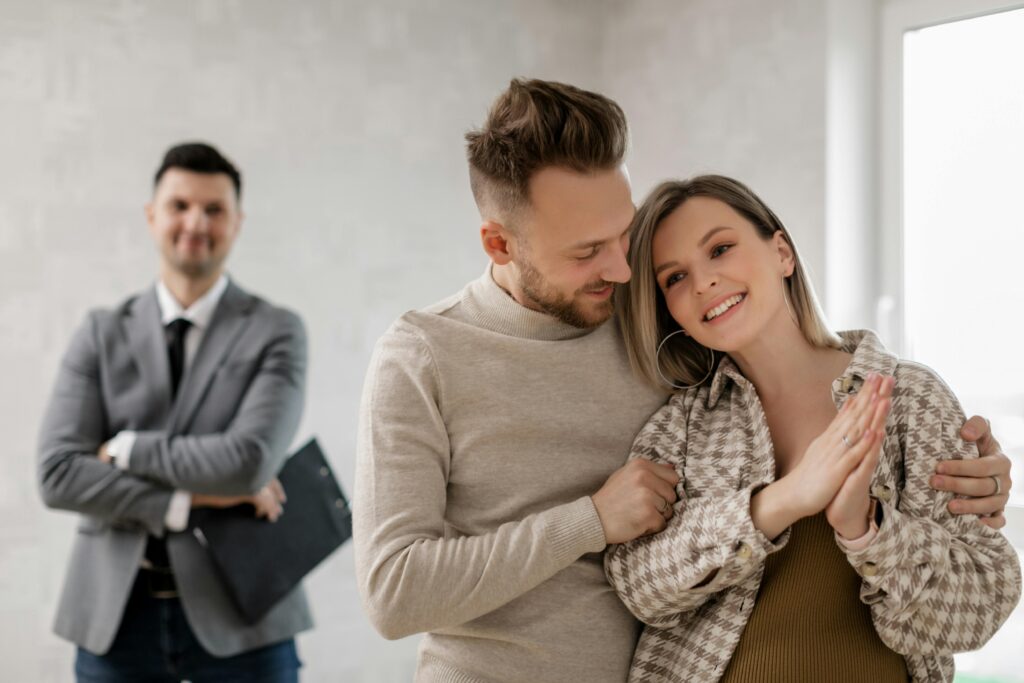 Man and woman couple happy clients after home buying with Realtor marketing post-closing for referrals and raving fan business
