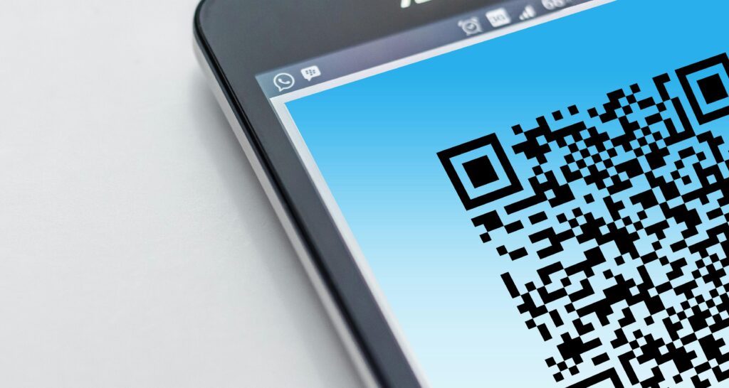 Phone screen showing a partial QR code, representing flyers and print mail marketing for realtors that integrates QR technology for lead generation