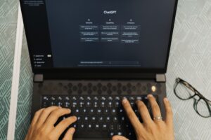 Laptop with ChatGPT on the screen, showcasing how buyers and sellers use LLMs and AI search to find the best local real estate agents